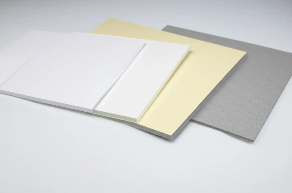 White, cream and grey paperboard sheets showing different thicknesses